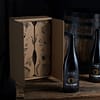2 bières d'exception brasserie maddam posées sur une table en bois